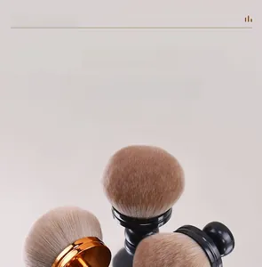 Macro view of fluffy mushroom powder brushes with dense synthetic bristles and gold handles