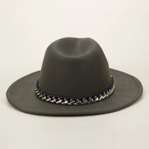 Detailed view of olive green woolen fedora hat with silver chain and blue ribbon