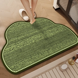 Green cloud-shaped absorbent bathroom mat with dot and stripe pattern and non-slip backing
