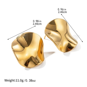 Macro shot of 18k gold plated chunky irregular wave earrings with size measurements