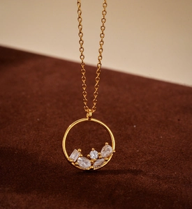 Macro detail of gold S925 silver pendant with mixed-cut zircon stones on cross chain