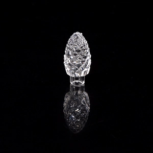 Macro shot of a transparent pine cone crystal ornament with high light refraction
