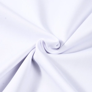 Close-up of white knitted fabric texture showing soft breathable weave on slim-fit top