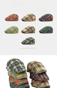 Detail of reversible washed cotton plaid beret hats in multiple color patterns