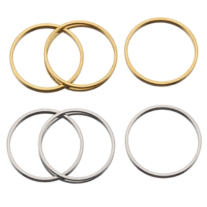 Detailed view of polished gold and silver stainless steel flat rings for DIY crafts