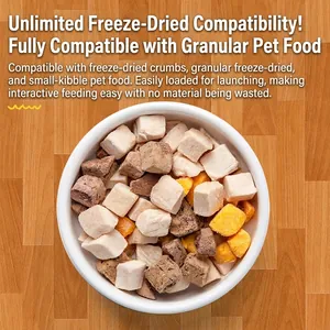 Interactive pet treat launcher toy with assorted freeze-dried meat cubes in a ceramic bowl