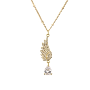 Golden angel wing necklace with sparkling pavé crystals and a teardrop diamond pendant