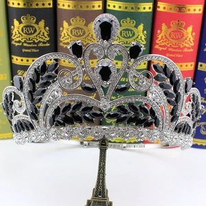 Detail of luxury bridal crown with black and clear zircons on elegant display stand
