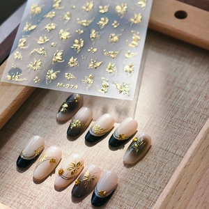 Golden embossed floral nail art stickers with butterfly patterns for elegant manicure M-976