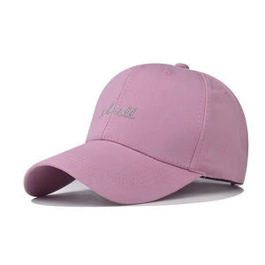 Close-up of silver shell embroidery on washed cotton pink baseball cap detail