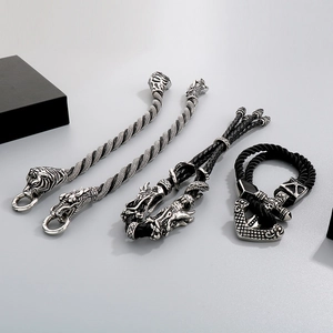 Detail of vintage men's bracelets with dragon and tiger heads in antique finish steel