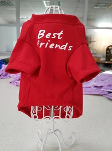 Detail view of red pet T-shirt featuring Best Friends text on a white hanger