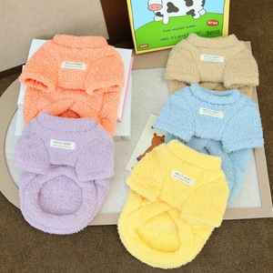 Colorful plush pet sweaters in orange, purple, yellow, and blue made of warm fleece fabric