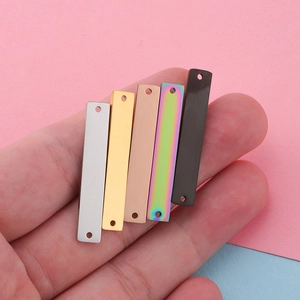 Rectangle mirror polished stainless steel connectors in five metallic finishes shown on hand