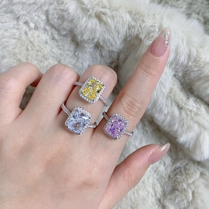 Macro shot of S925 silver rings with radiant cut yellow, white, and pink gemstones