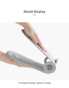 Detail showing the adjustable V-shaped folding mechanism of this gray plastic shoe stacker