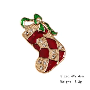 Christmas stocking brooch with red and green enamel inlay and sparkling rhinestones