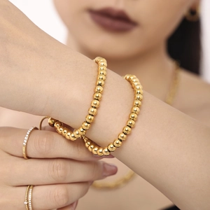 Polished 4mm gold beaded stainless steel bracelet with matching minimalist rings
