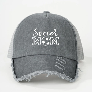 Close-up of Soccer MOM washed baseball cap with mesh back and distressed brim detail