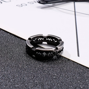 Detail of vintage blade-shaped stainless steel ring in antique silver for men's hip-hop style