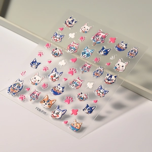 Close-up of FEB-735 embossed 5D nail stickers featuring cute cartoon cats and pink paw prints