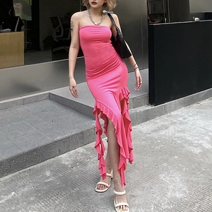 Pink strapless dress featuring ruffled trim and an asymmetrical hem for beach vacations