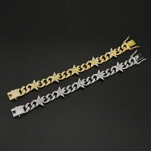 Close-up of gold and silver hip hop star bracelets with encrusted sparkling crystals