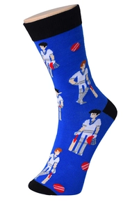 Detail of blue cotton sock with cricket pattern and black accents on model's foot