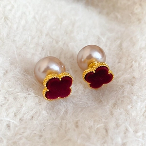 Detail of red clover stud earrings with faux pearl and gold-plated beaded edges