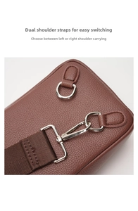 Detail of brown litchi leather bag with D-ring for reversible shoulder strap switching