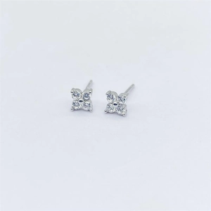Close-up of S925 sterling silver four-leaf flower stud earrings with sparkling zircons