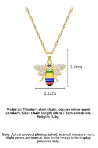Detail of bee pendant with rainbow enamel, white zircon pavé, and titanium steel chain
