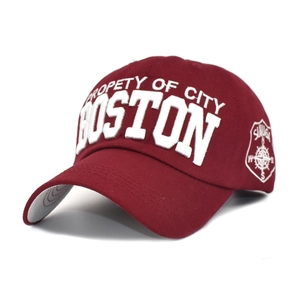Detail of burgundy baseball cap with 3D Boston embroidery and side compass shield patch