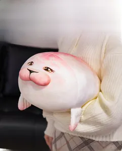 Close-up of soft plush seal toy with pink gradient and cute blushing face for gifting