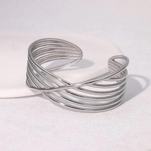 Minimalist silver stainless steel open bangle with geometric crisscross parallel lines