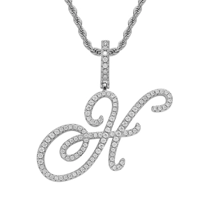 Macro shot of silver letter H pendant with handset pavé stones on thick rope chain