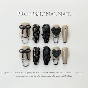 Handmade checkerboard press-on nails with 3D black bear and heart-shaped charms