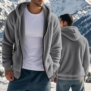 Detail of grey fleece zip-up hoodie featuring a textured fabric against a snowy mountain backdrop