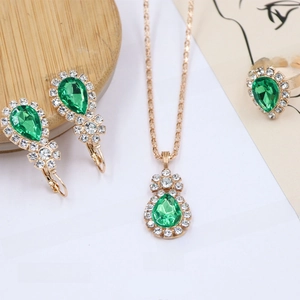 Detailed view of green water-drop crystal jewelry set with earrings, necklace and ring