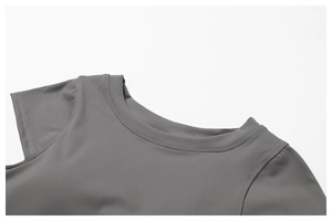 Macro detail of dark grey high-elastic yoga top showing double-stitched neckline and fabric