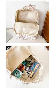 Detailed interior of floral backpack showing main compartment capacity and pockets