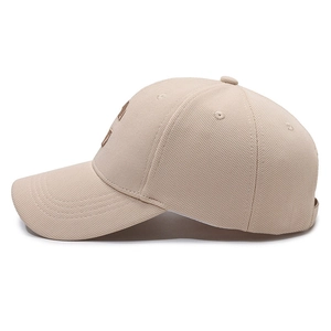 Minimalist beige knitted baseball cap with side view showing textured fabric and square logo