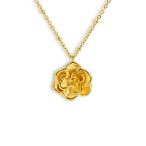 Detailed close-up of a 18K gold-plated stainless steel rose flower pendant on a beaded chain