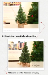 Detail of a mini green Christmas tree featuring a natural burlap base for festive tabletop decor