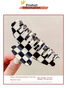 Detail view of large black and white checkerboard resin hair claw clip with size dimensions