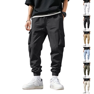 Detail view of cargo pants showing multi-pocket design and elastic drawstring waist cuff