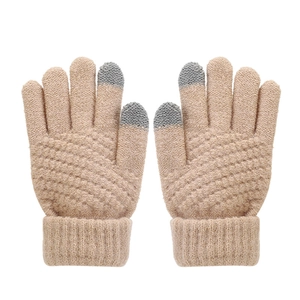 Close-up of khaki knitted touchscreen gloves with grey fingertips and ribbed cuffs