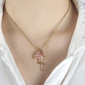 Golden flamingo pendant necklace with pink pear-shaped gemstone and zircon accents