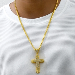 Hip hop style gold cross pendant necklace with sparkling clear stones on a gold chain