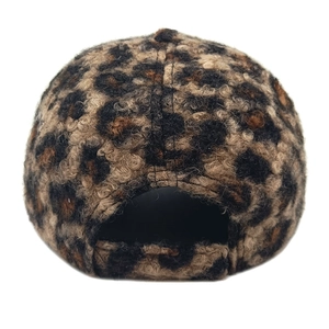 Detail view of leopard print faux teddy fur baseball cap with adjustable back closure
